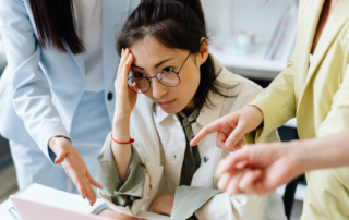 Stressed orthodontic staff member overwhelmed by inadequate workplace training.